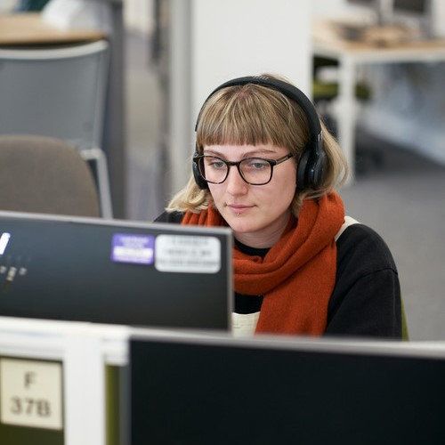 A Digital Pedagogy student working on a computer